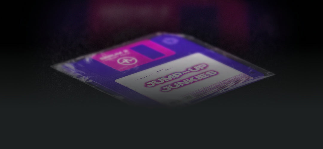 Angled 3D product render of the Sonic Weaponry Jump-Up Junkies floppy disk, featuring high-energy branding and packaging for the specialized Drum & Bass Serum 2 preset pack.